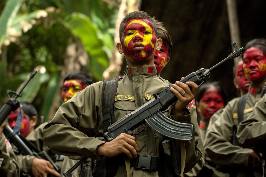 Guerillas of the New People's Army (NPA) in formation in the Sierra Madre mountain range, located east of Manila. Photo: AFP
