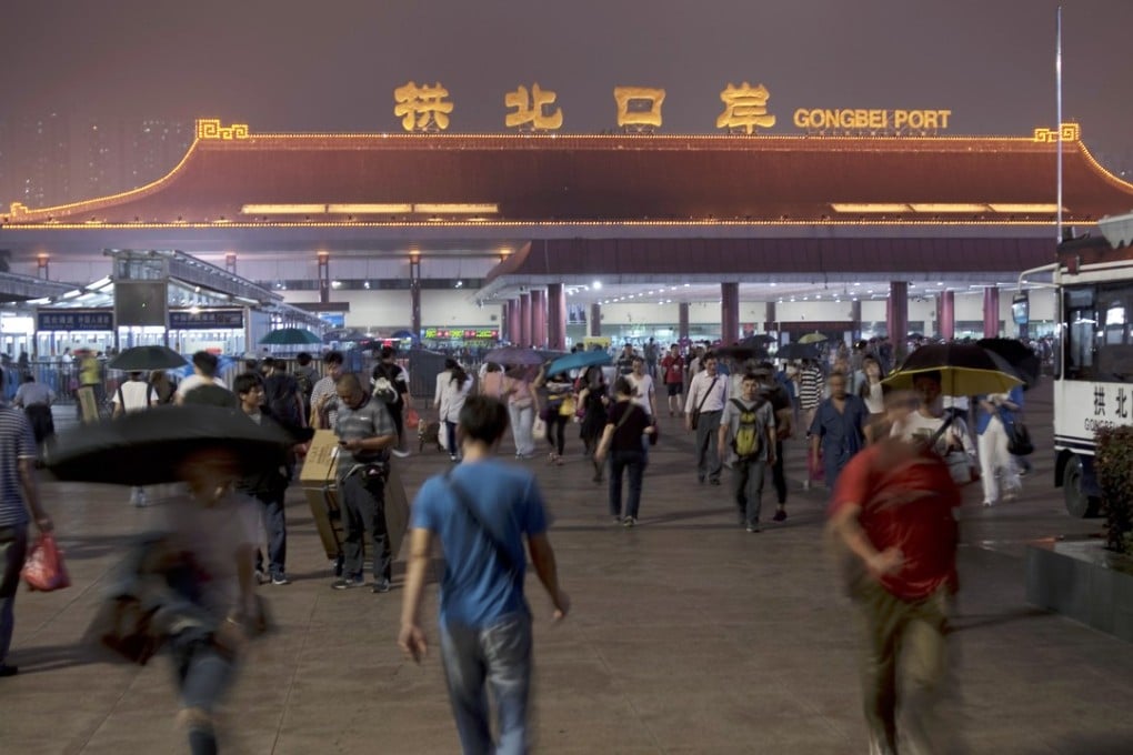 Customs officers at Gongbei Port at the border of Zhuhai and Macau now employ facial recognition technology. Photo: Xiaomei Chen