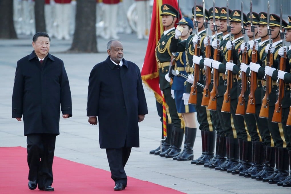 Chinese President Xi Jinping and Djibouti President Ismail Omar Guelleh take part in a welcoming ceremony at the Great Hall of the People in Beijing on Thursday. Photo: Reuters