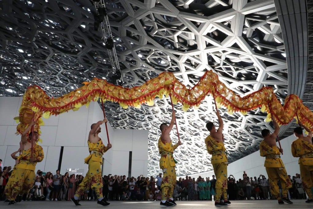 Korean dancers perform during the opening of the Louvre Abu Dhabi Museum, celebrated as a “bridge between civilisations”, on November 11. The museum’s silver-toned dome with perforated arabesque patterns aims to create what architect Jean Nouvel described as a “rain of light”. Photo: AFP