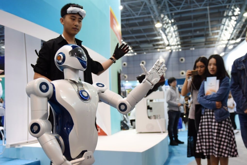 People look at a bionic robot at an exhibition during the 2017 national mass innovation and entrepreneurship week in Beijing, capital of China, Sept. 15, 2017.