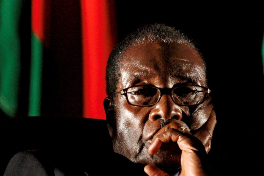 Zimbabwe’s former President Robert Mugabe watches a video presentation during the summit of the Southern African Development Community in Johannesburg, South Africa on August 17, 2008. Photo: Reuters