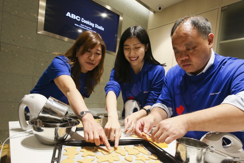 Gingerbread-making volunteers Yvonne Chan, Fay Fang and Arthur Mak at Taikoo Place. Photo: David Wong