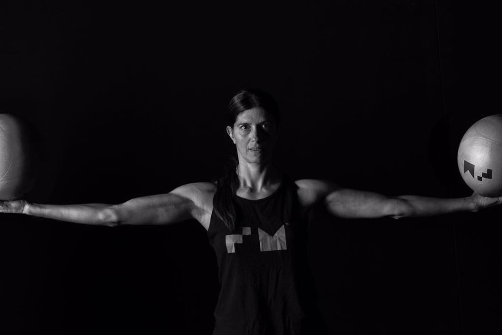 Linda Kapetanea with large – but light – wooden balls. They may not weight much, but even the strong struggle to use the Fighting Monkey tools. Photos: Handout