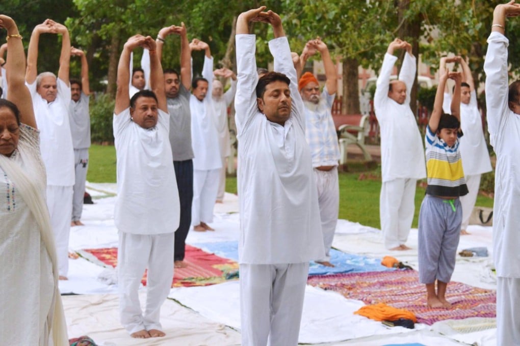 The yoga pose surya namaskar, meaning sun salutation, is among Indian English additions to the Oxford English Dictionary. Picture: AFP