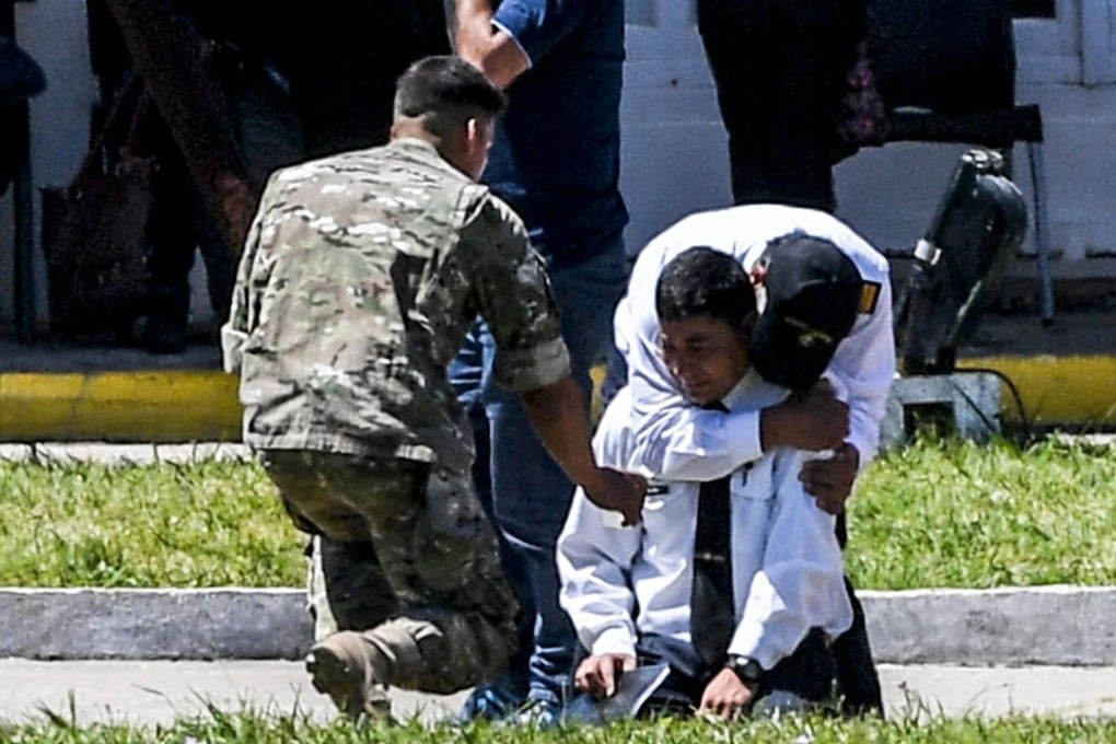 Relatives of 44 crew members of Argentina’s missing submarine break down in grief after the navy said the vessel was hit by an explosion. Photo: AFP