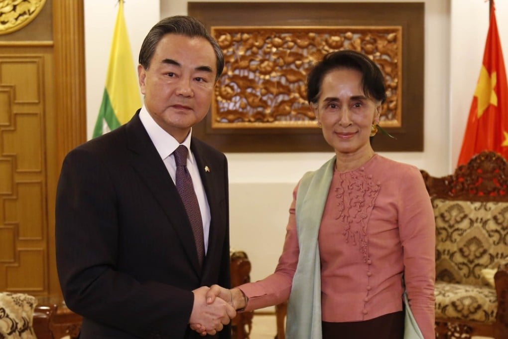 Chinese Foreign Minister Wang Yi shakes hands with Myanmar's Aung San Suu Kyi in Naypyidaw, Myanmar, in April 2016. Photo: Xinhua