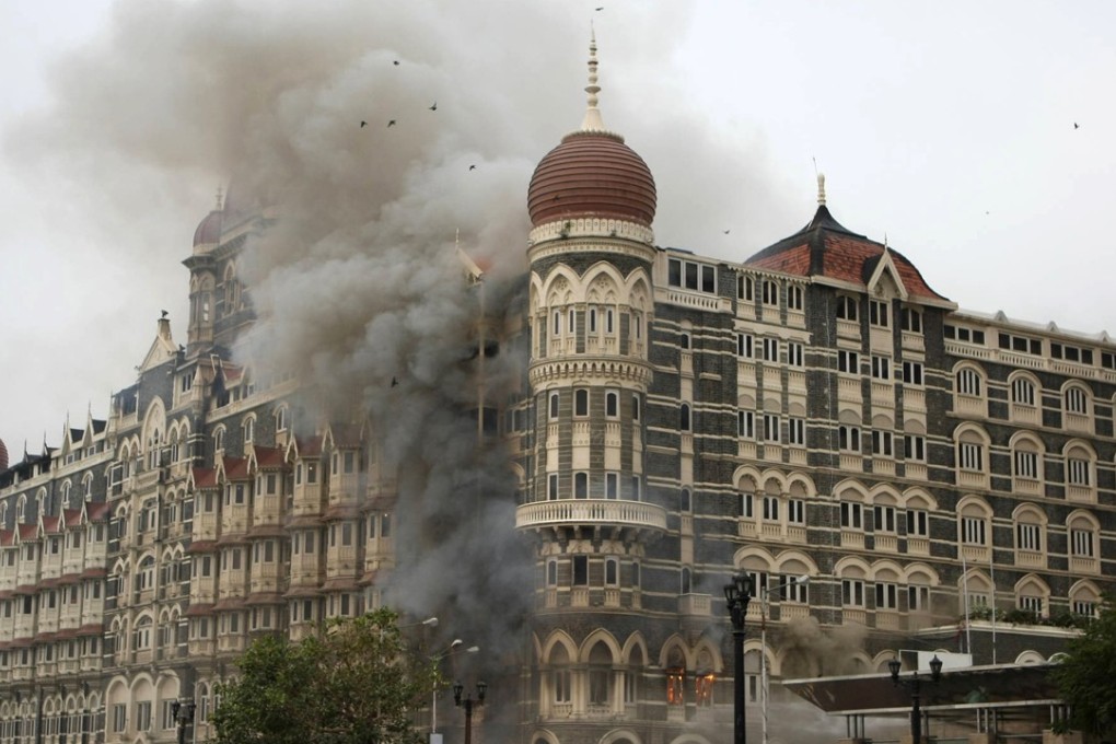 Smoke pours from the Taj Mahal hotel in Mumbai on November 29, 2008, after Muslim militants attacked. Photo: AFP