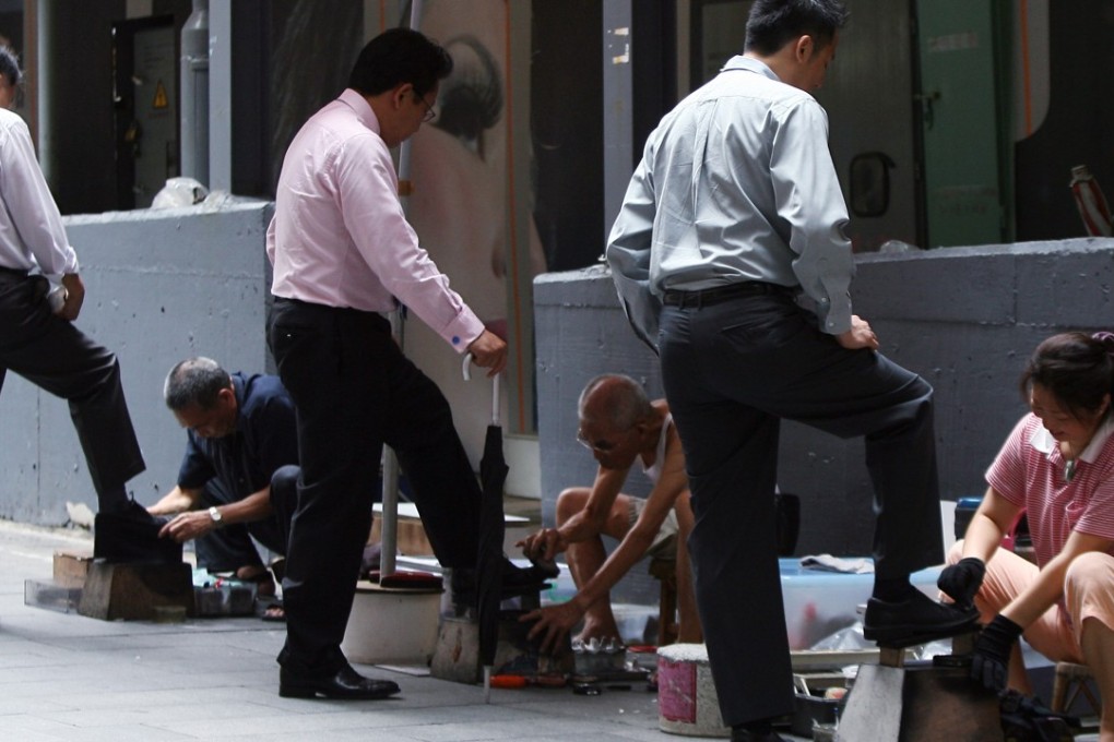 Cobblers on Theatre Lane, Central in 2009. Some today are trying out new modes of payment. Photo: David Wong