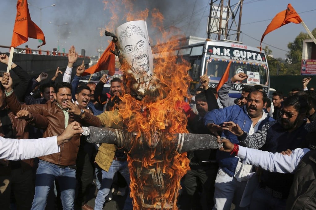 Members of India’s Rajput community burn an effigy of film director Sanjay Leela Bhansali as they protest against the release of Bollywood film Padmavati in Jammu, India on Friday, November 24, 2017. Photo: AP