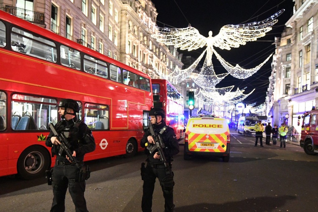 Armed London police officers react to an incident near Oxford Circus tube station in Oxford Street, central London, Britain. Photo: EPA