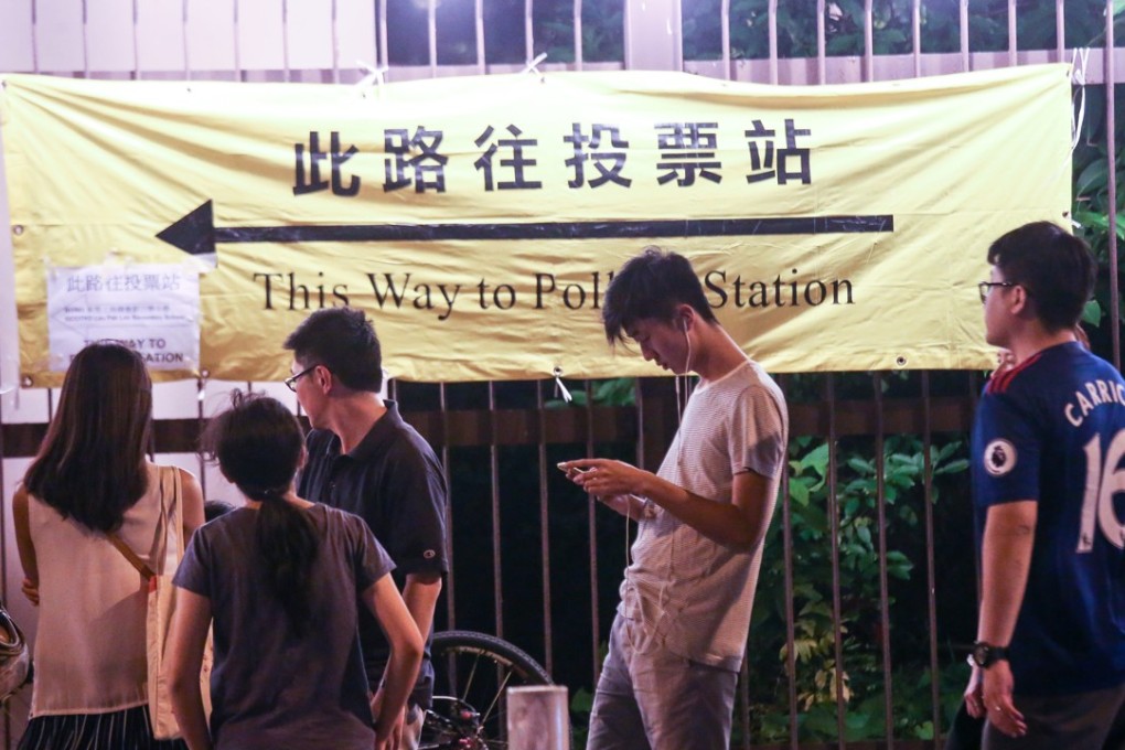 People queue up to vote for 2016 Legislative Council General Election at a polling station in Tai Wai. Photo: David Wong