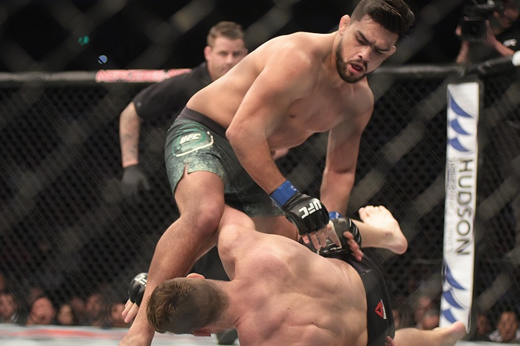 Kelvin Gastelum has Michael Bisping in trouble in the first round of their bout in Shanghai. Photo: Mike Miguel