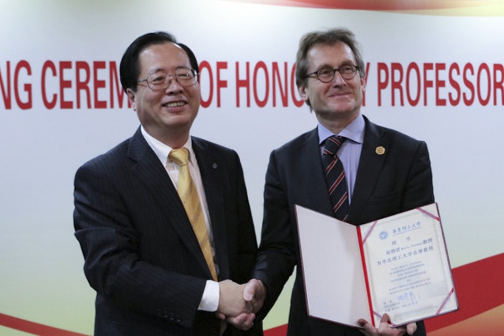East China University of Science and Technology president Qu Jingping (left) congratulates chemist Bernard Feringa on his appointment as an honorary professor of the university earlier this month. Photo: East China University of Science and Technology