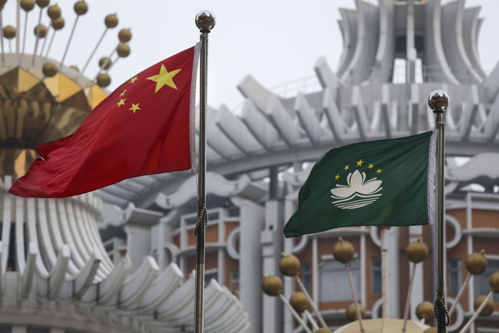 The Chinese national flag flies alongside Macau’s flag in the casino hub. Photo: Dickson Lee