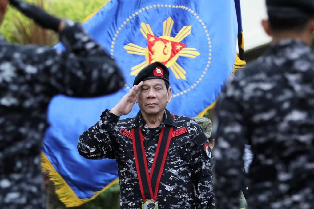 Philippine President Rodrigo Duterte salutes at a military camp in San Miguel, Bulacan province. Photo: EPA