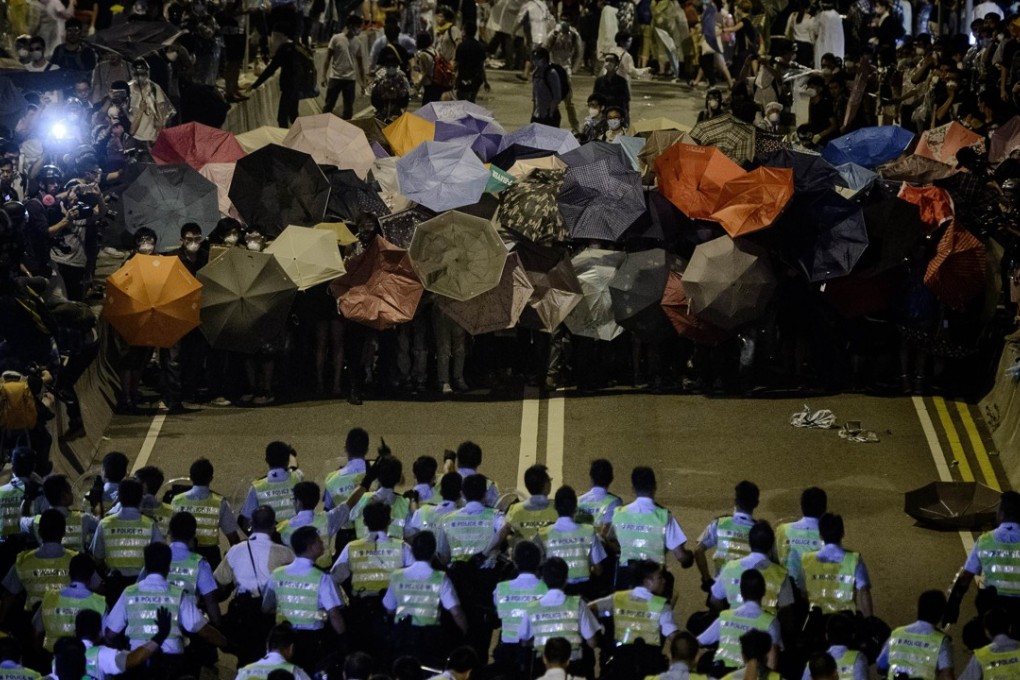Police and protesters during the Occupy movement on October 14, 2014. Photo: AFP