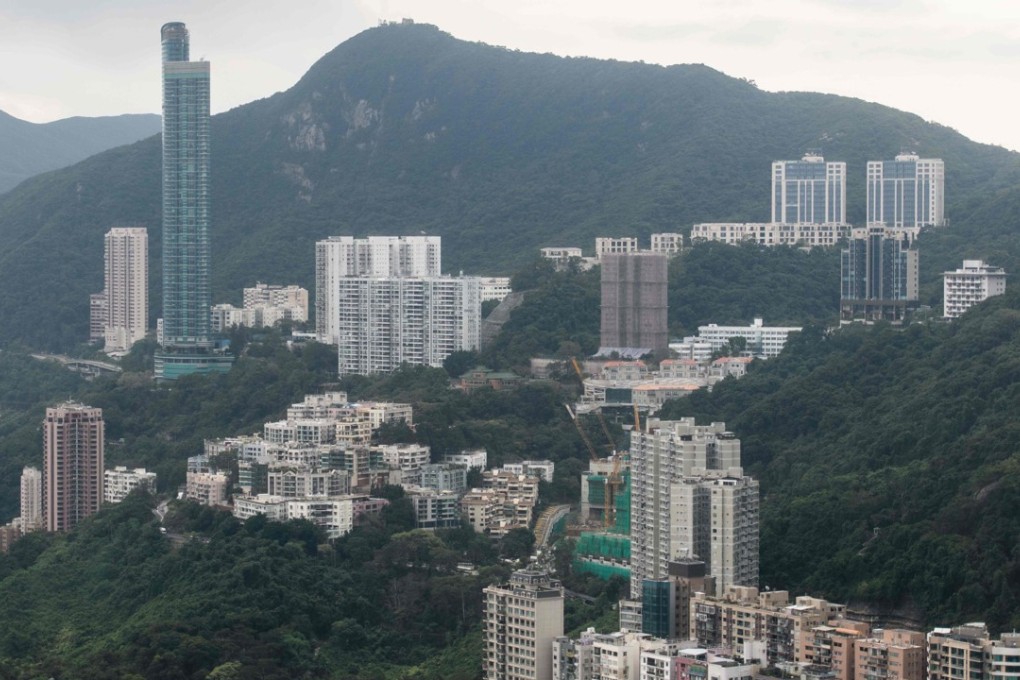 A record price for a home in Asia was set this month after two apartment units at Mount Nicholson (top right), a luxury housing development on The Peak in Hong Kong, were sold for HK$1.16 billion (US$149 million) to a single buyer. Hong Kong’s skyrocketing housing prices are a result of market distortions and irregularities, particularly in mortgages. Photo: AFP