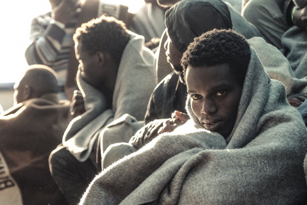 African migrants arrive in Trapani harbour, southern Italy, on Saturday. But some African would-be migrants have been intercepted by Libyan slave traders, in an illicit industry recently exposed by CNN. Photo: AP