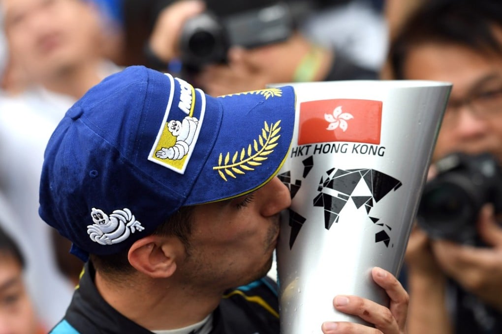 Sebastien Buemi kisses his trophy after winning in Hong Kong. Photos: Formula E