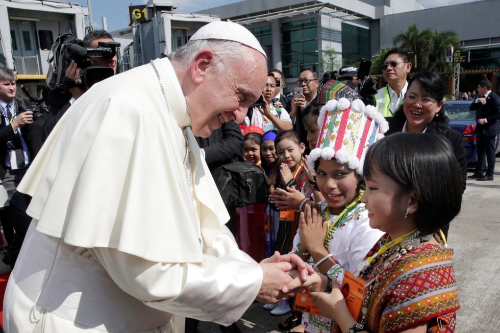Pope Francis arrives at Yangon International Airport. Photo: Reuters