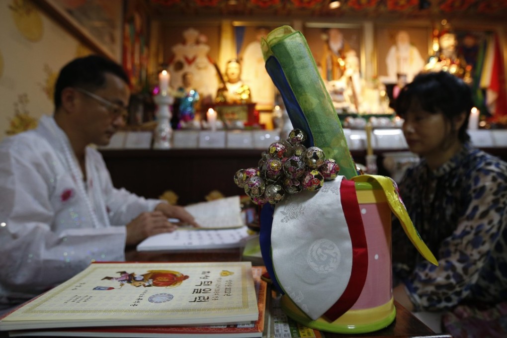 A shaman in Seongnam, south of Seoul. Photo: REUTERS/Kim Hong-Ji