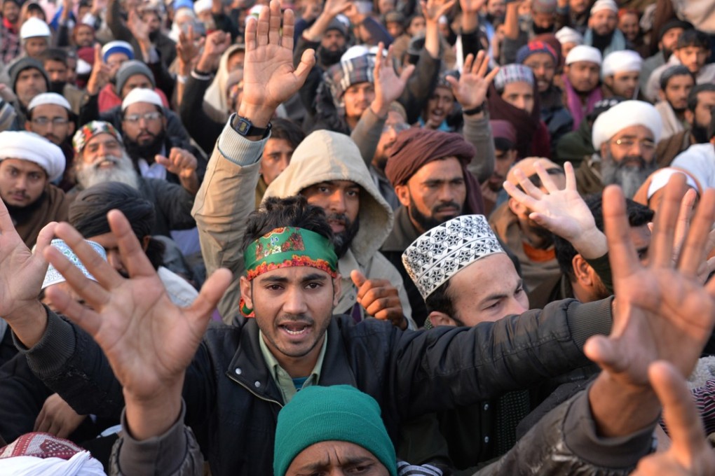Islamists at a sit-in at a blocked flyover in Islamabad. Photo: AFP