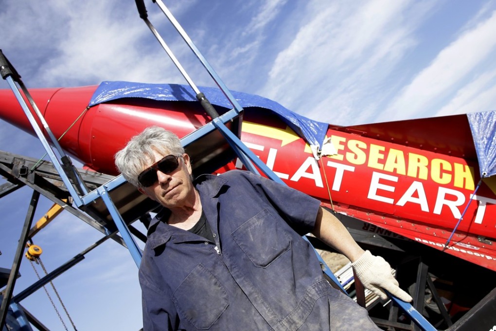 ‘Mad’ Mike Hughes stands beside his rocket. Photo: EPA