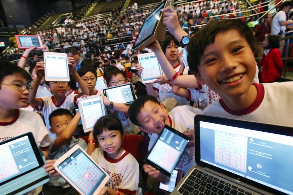 Students attend the Chinese Chess Challenge “1K vs AI” Battle Day at Queen Elizabeth Stadium in Wan Chai, where 1,000 students played against Chinese chess artificial intelligence systems on October 27. Photo: David Wong