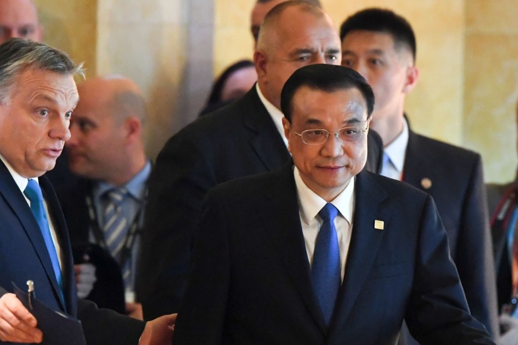 Chinese Premier Li Keqiang (centre) arrives with the Hungarian Primer Minister Viktor Orban (left) for a summit of 16 central and eastern European nations in Budapest. Photo: Agence France-Presse