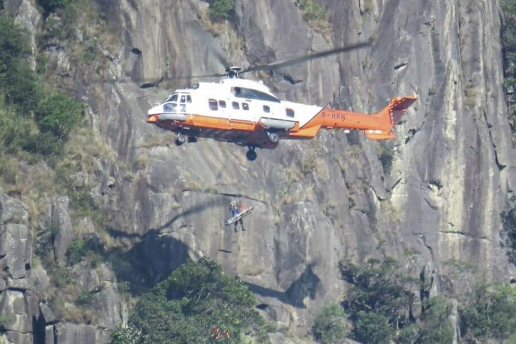 A helicopter from the Hong Kong Government Flying Service rescued the female hiker, who fell down a steep slope dubbed “suicide cliff” in Ma On Shan Country Park. Photo: Facebook