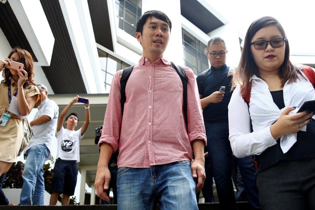 Civil rights activist Jolovan Wham leaves the State Court after a hearing in Singapore. Photo: Reuters