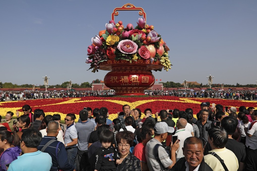 Visitors to Tiananmen Square, Beijing, on China's National Day on October 1. The number of Chinese holidaying domestically surged 10 per cent last year, much faster than the growth in the number of those going abroad. Photo: AP