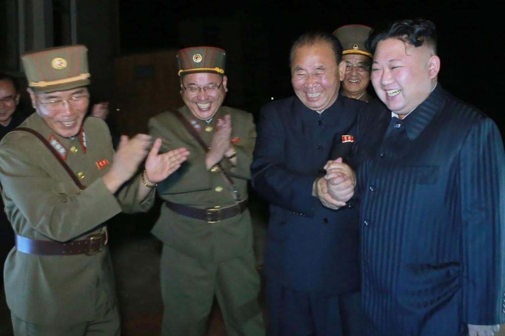 North Korean leader Kim Jong-un celebrates a test launch of an intercontinental ballistic missile (ICBM), Hwasong-14 in July. File photo: AFP
