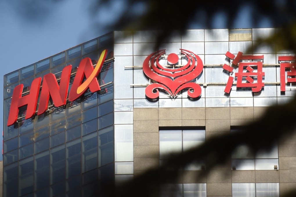 The HNA logo on a building in Beijing. The company is considering a public share offering of its Gategroup air catering unit, possibly in Switzerland. Photo: AFP
