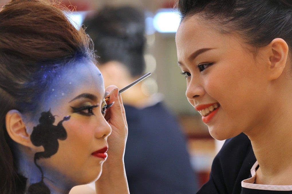 Lau Wai-yin, graduate of the Diploma of Vocational Education (Beauty Care), Youth College and Model Chan Yuk-ching, demonstrate make up at Youth College (Yeo Chei Man) in Tseung Kwan O. Photo: Dickson Lee