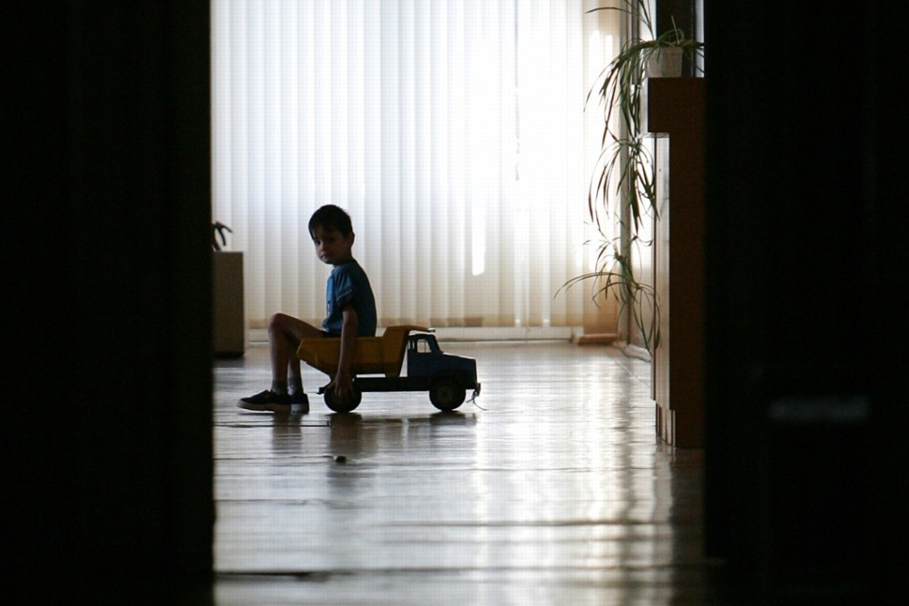 A young patient plays with a toy truck in an infectious diseases hospital in Moscow. Fewer than half of Russians with HIV are taking antiretroviral drugs, in part because of a conspiracy theory that the Aids-causing virus is a myth invented by the West. Photo: Agence France-Presse