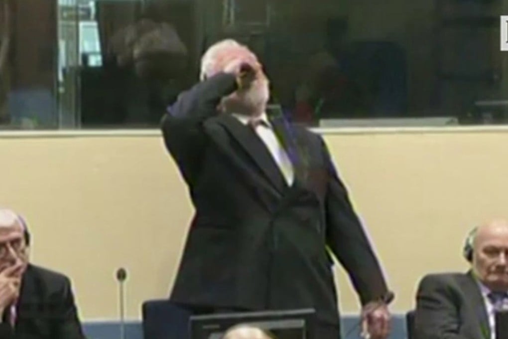 Bosnian Croat general Slobodan Praljak and war crimes convict drinks poison in a UN war crimes court in the Netherlands. Photo: Zuma Press/TNS