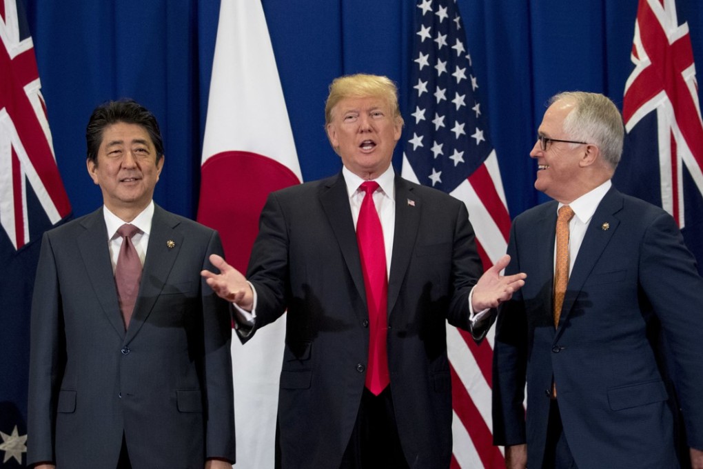 Australian Prime Minister Malcolm Turnbull (right) accompanied President Donald Trump (centre) and Japanese Prime Minister Shinzo Abe (left) at a meeting during the ASEAN Summit on November 13, 2017, in Manila, Philippines. Photo: AP
