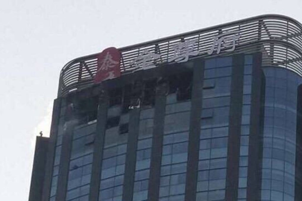 The blaze struck the top floor of the building in Tianjin. Photo: Weibo