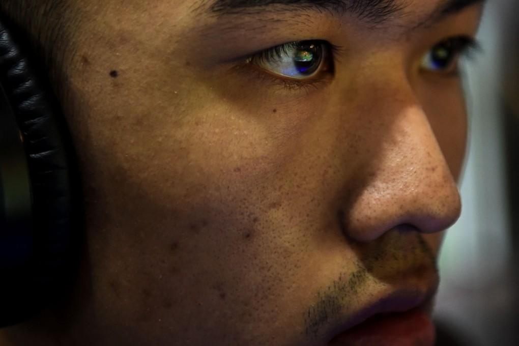 A gamer plays League of Legends during training for the League of Legends World Championship at a boot camp in Shanghai. Photo: AFP