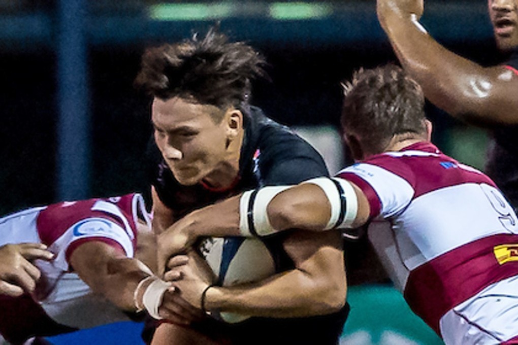 Hugo Chui takes the tackle against Kowloon earlier this season. Photo: HKRU