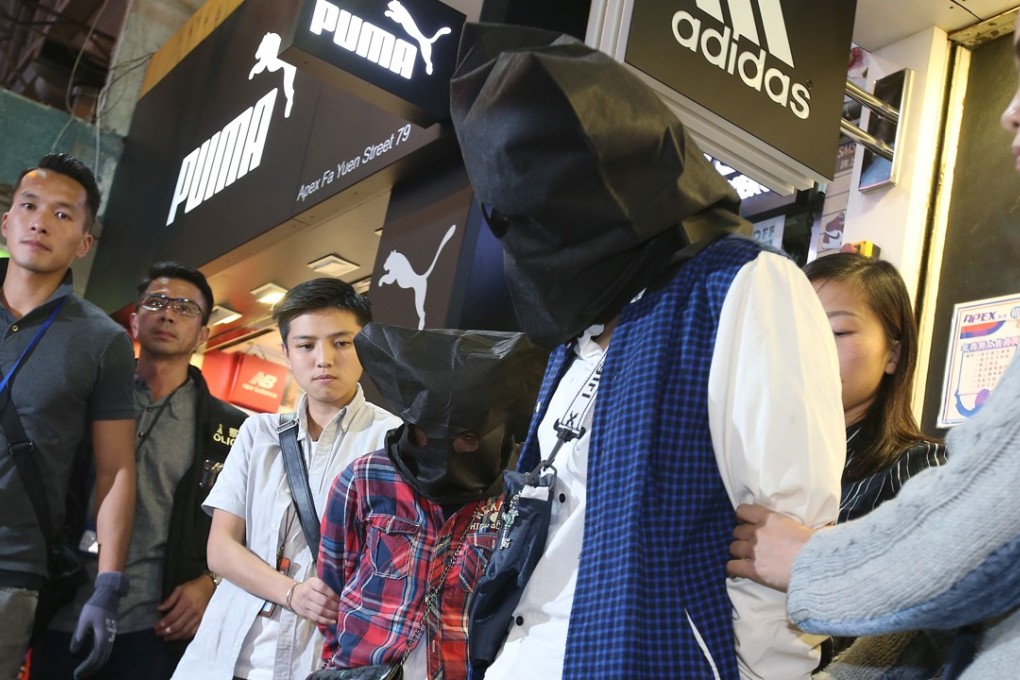 Police officers arrest two women in Mong Kok. Photo: David Wong