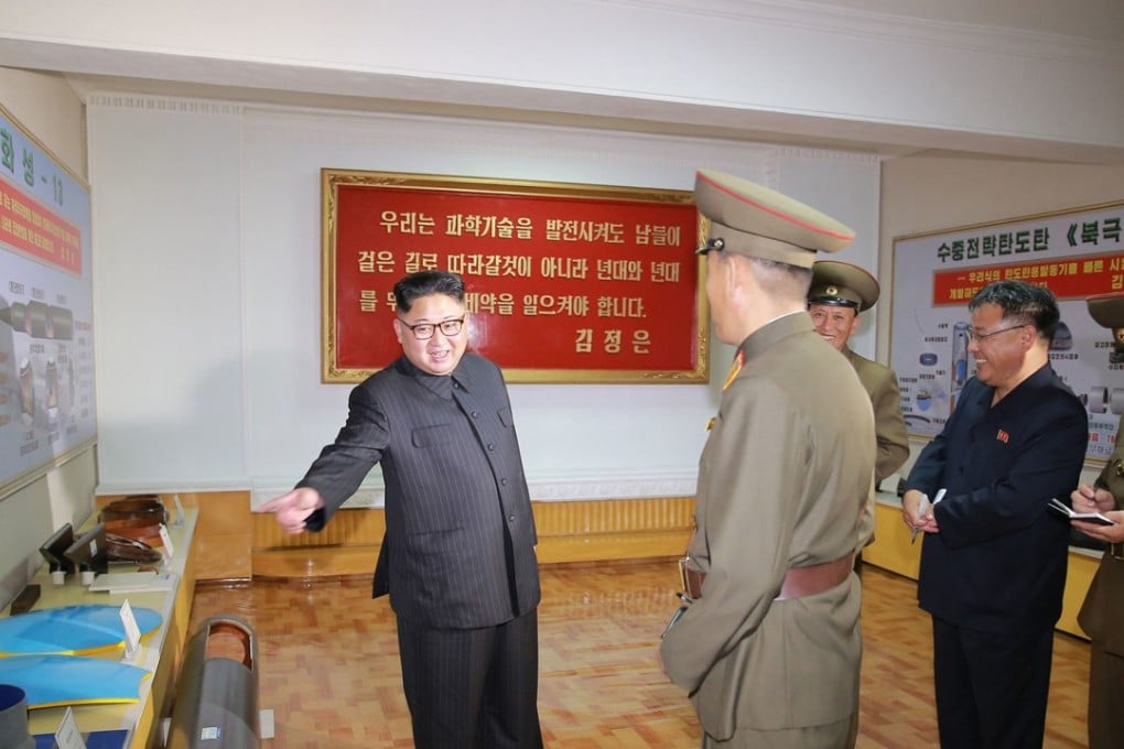 A North Korean government photo shows Kim Jong-un at a military research institute that has been working on the Pukguksong-3 missile. Photo AP