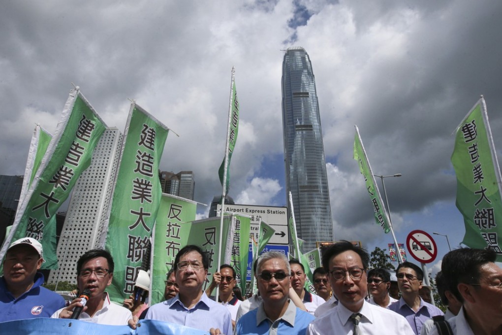 Groups representing the construction trade take part in a protest rally in June this year against filibustering in Legco’s Finance Committee. Because of the filibustering, the Finance Committee approved only about half of the HK$130 billion needed for the construction projects approved in the 2016/17 legislative year. Photo: David Wong