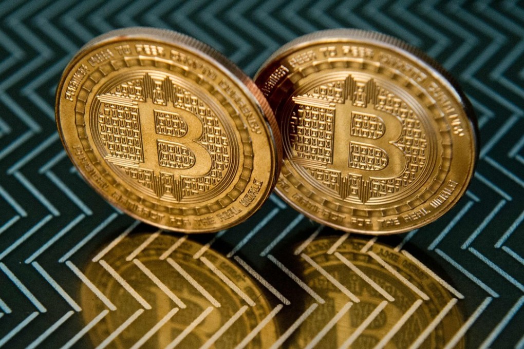 File photo of bitcoin in Washington. A senior Fed official warned bitcoin may pose a threat to financial stability after racing past US$11,000 this week. Photo: AFP