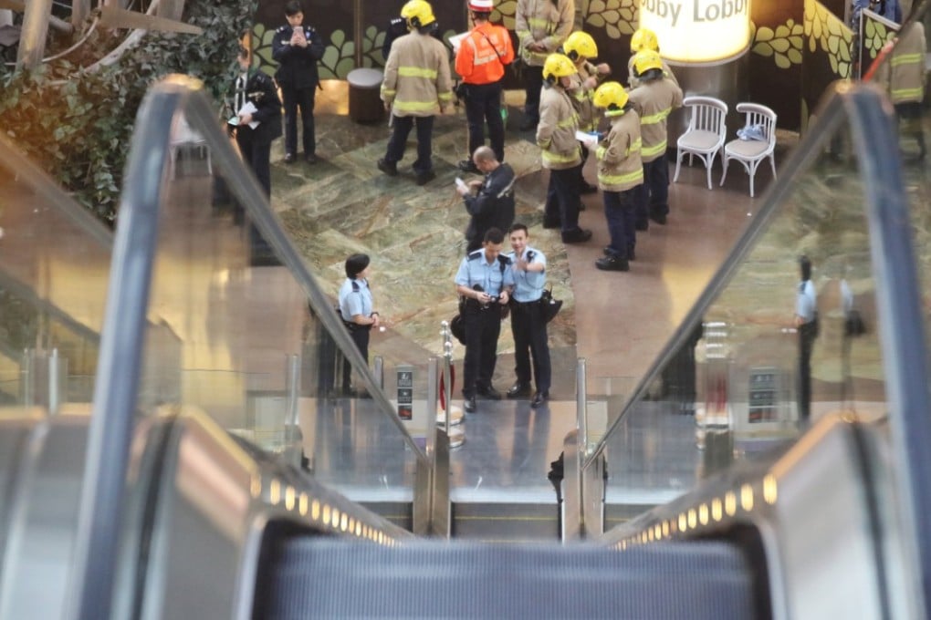 Police officers investigating the accident after an escalator malfunctioned while people were on it in Langham Place, Mong Kok, on March 25. Photo: Felix Wong