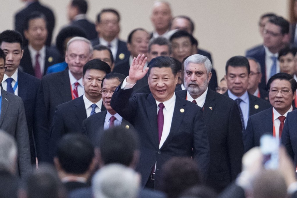 Chinese President Xi Jinping (centre) arrives with leaders at the opening ceremony of the international conference in Beijing on Friday. Photo: AP