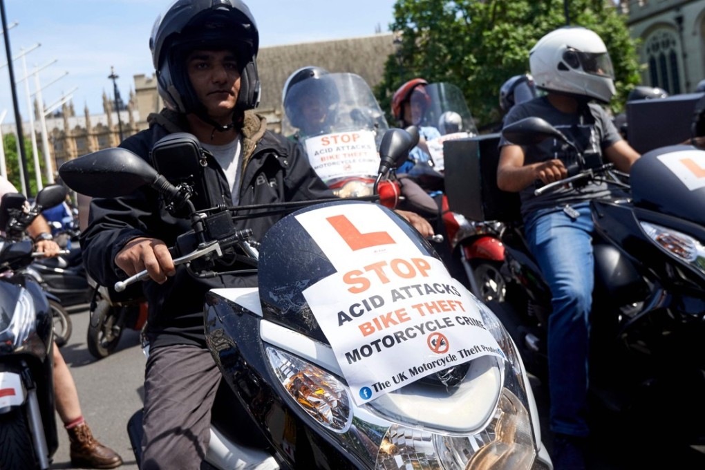 Motorcycle delivery drivers and motorcyclists gather in front of parliament in London demanding action on the rising number of acid attacks across the city. Photo: AFP