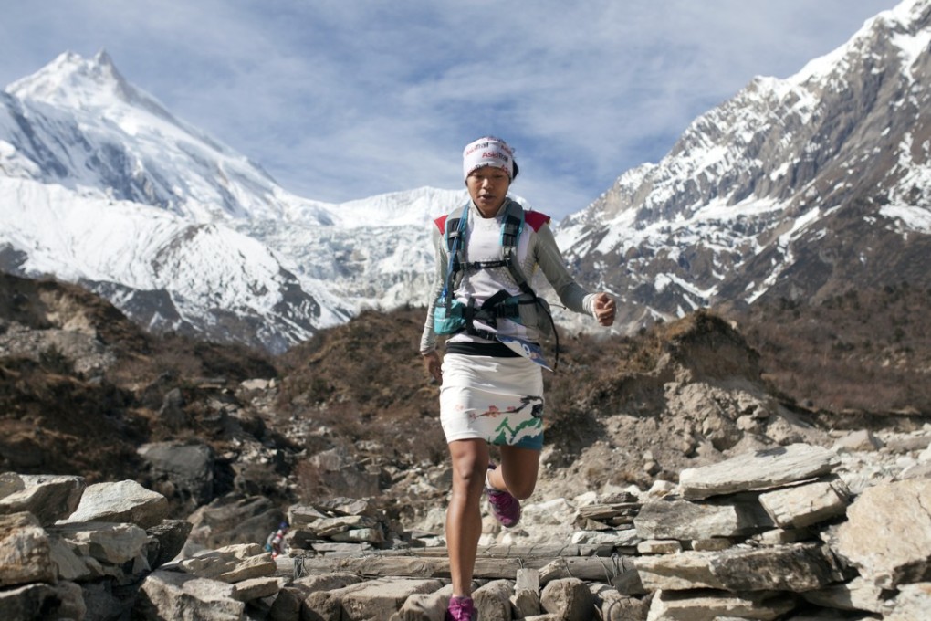 Nepalese runner Mira Rai runs in the mountains in Nepal.
